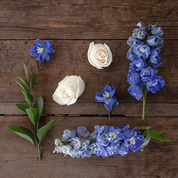 Dozen Cream Rose Table Arrangements