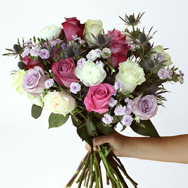 Purple Pastel Valentines Bouquet in a Hand