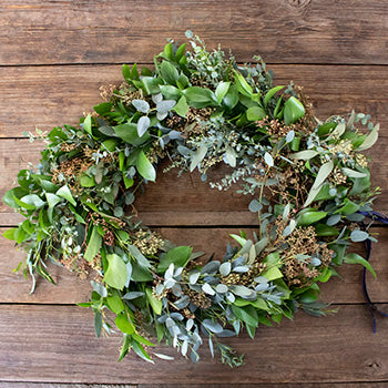 Floppy greenery mix wreath flatlay