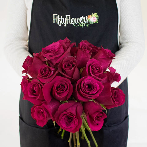 Merlot Red Roses in a Hand