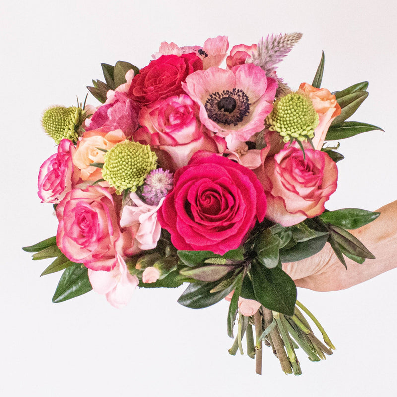 Playful Pink Flower Arrangement in Hand