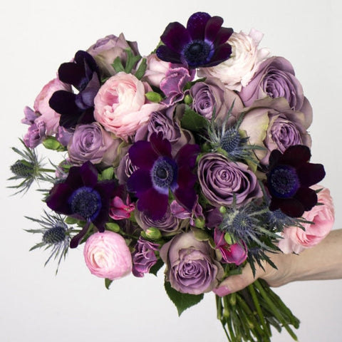 Purple Valentines Flower Bouquet in a Hand