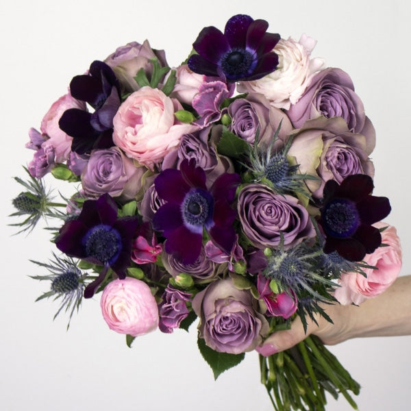 Purple Valentines Flower Bouquet in a Hand