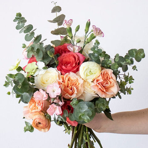 Simply Divine Peach Red Flower in Hand