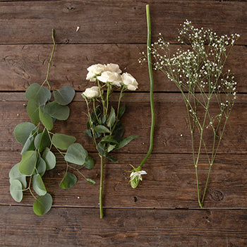 White flower greenery flatlay